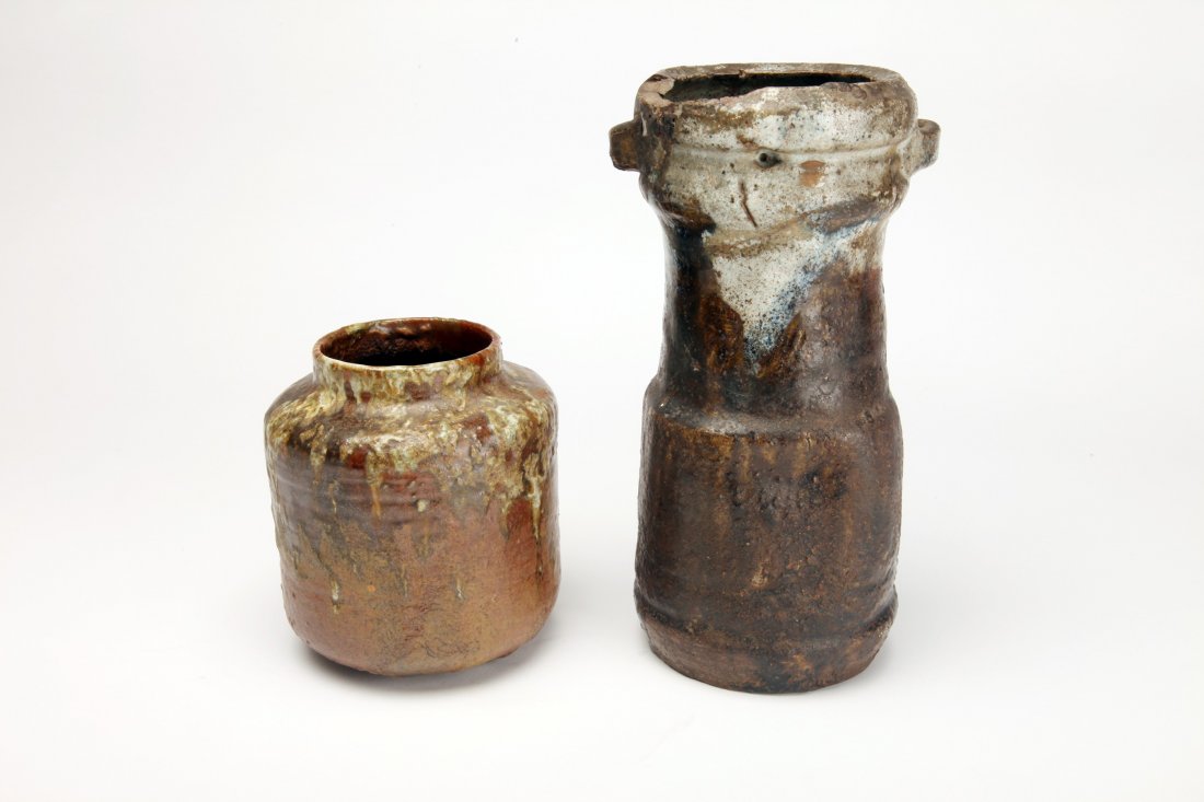 Two Early Japanese Ash Glaze Pottery Vessels: Japan, c. Edo Period; The taller with loop handles and partial old label at bottom. Height of tallest: 9" (23cm) Old East Side Providence, Rhode Island Collection.