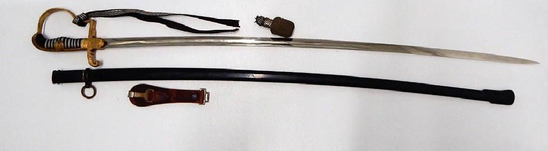 WWII German Staff Officers Sword: WW2 German Officer Sword. 32 " near mint blade marked Eikhorn Solingen. German insignia on cross guard. Reverse P Guard in excellent condition. Ebony grip . Iron Scabbard excellent with original detac