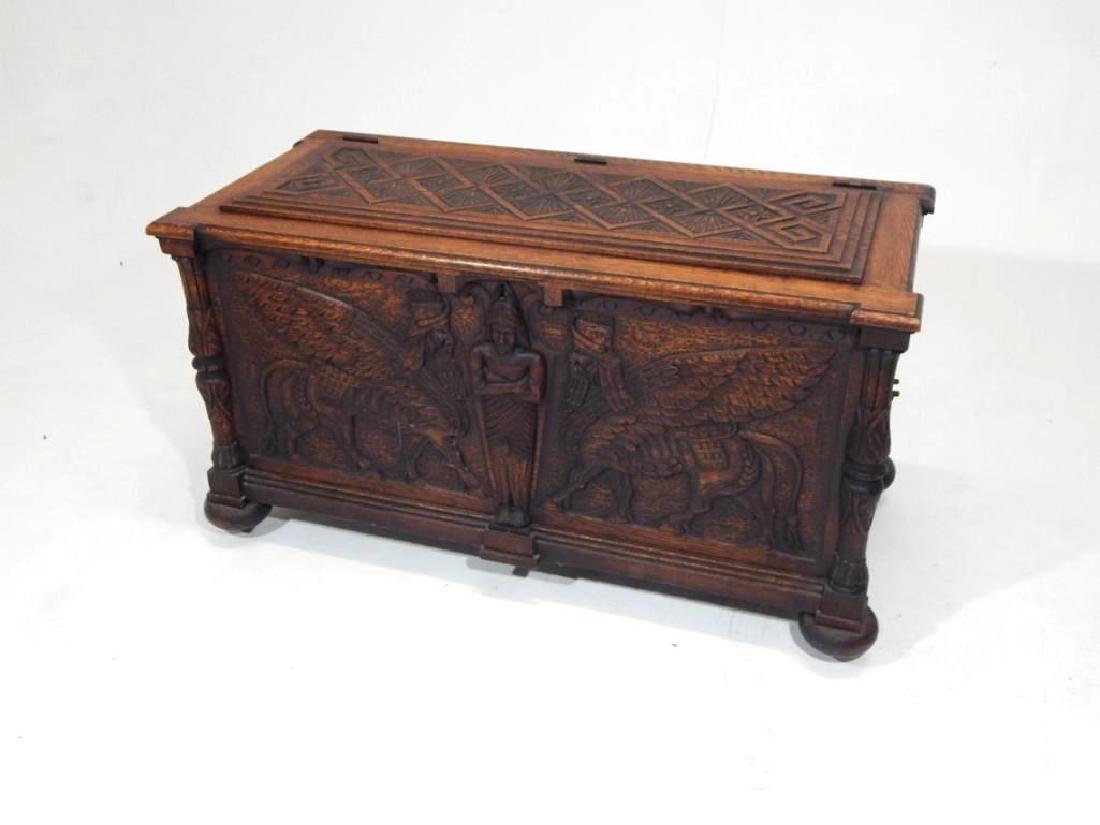 Antique Egyptian Revival Carved Chest: Egyptian Revival wood chest, the top and sides with geometric carving, the front with Egyptian figural carvings. Condition: Excellent Length: 48"Height: 26"