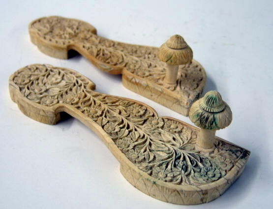 241 Pair Indian Ivory / Bone Wedding Sandals: Ca. 19th century, fine pair of intricatly carved design with foliate and vine design, measure 8 1/2" long.