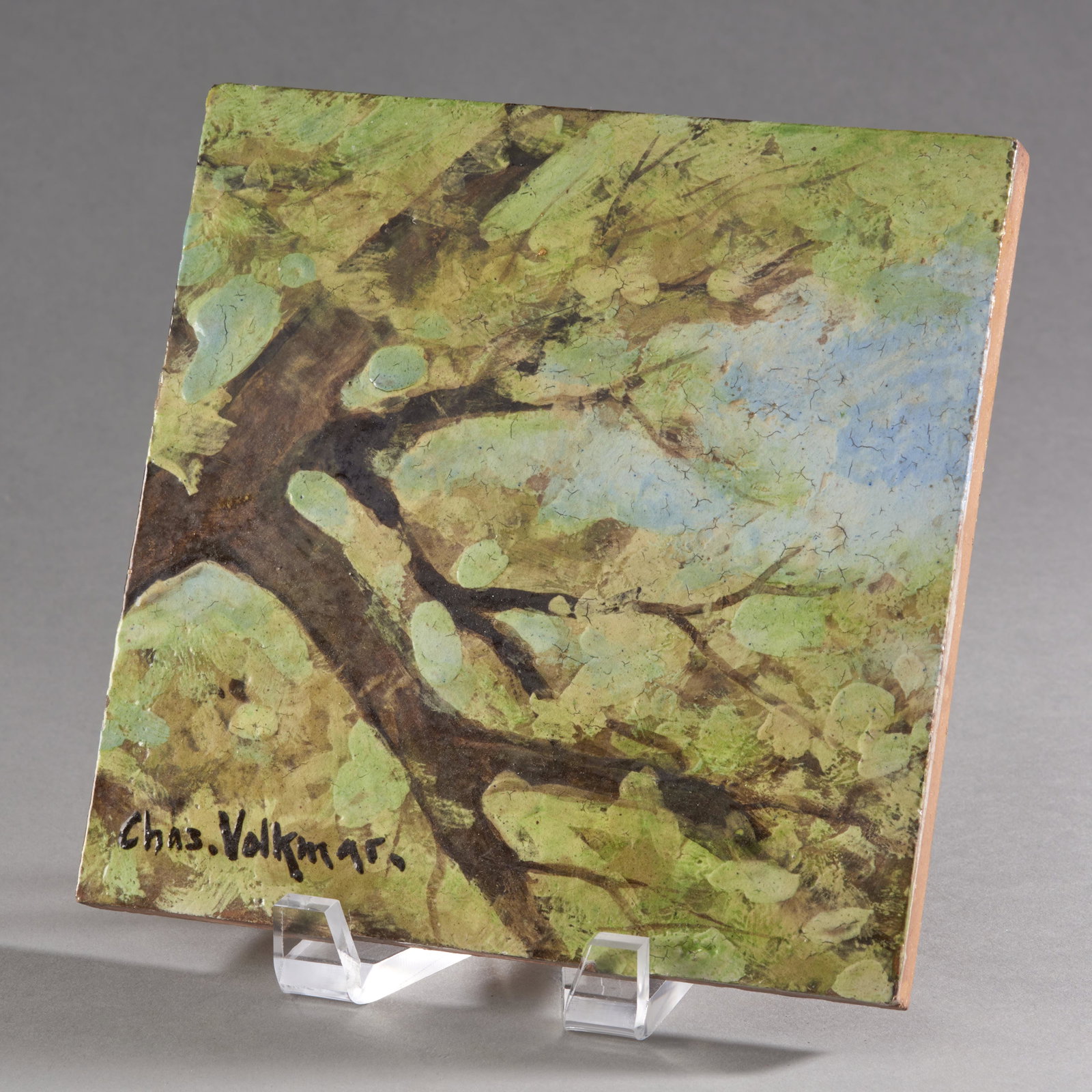 Charles Volkmar Art Pottery Tile: Charles Volkmar Art Pottery Tile depicting a tree branch with leaves early 20th century signed on face: Chas. Volkmar. Condition: excellent. Measures 8" square x 1/2" thick