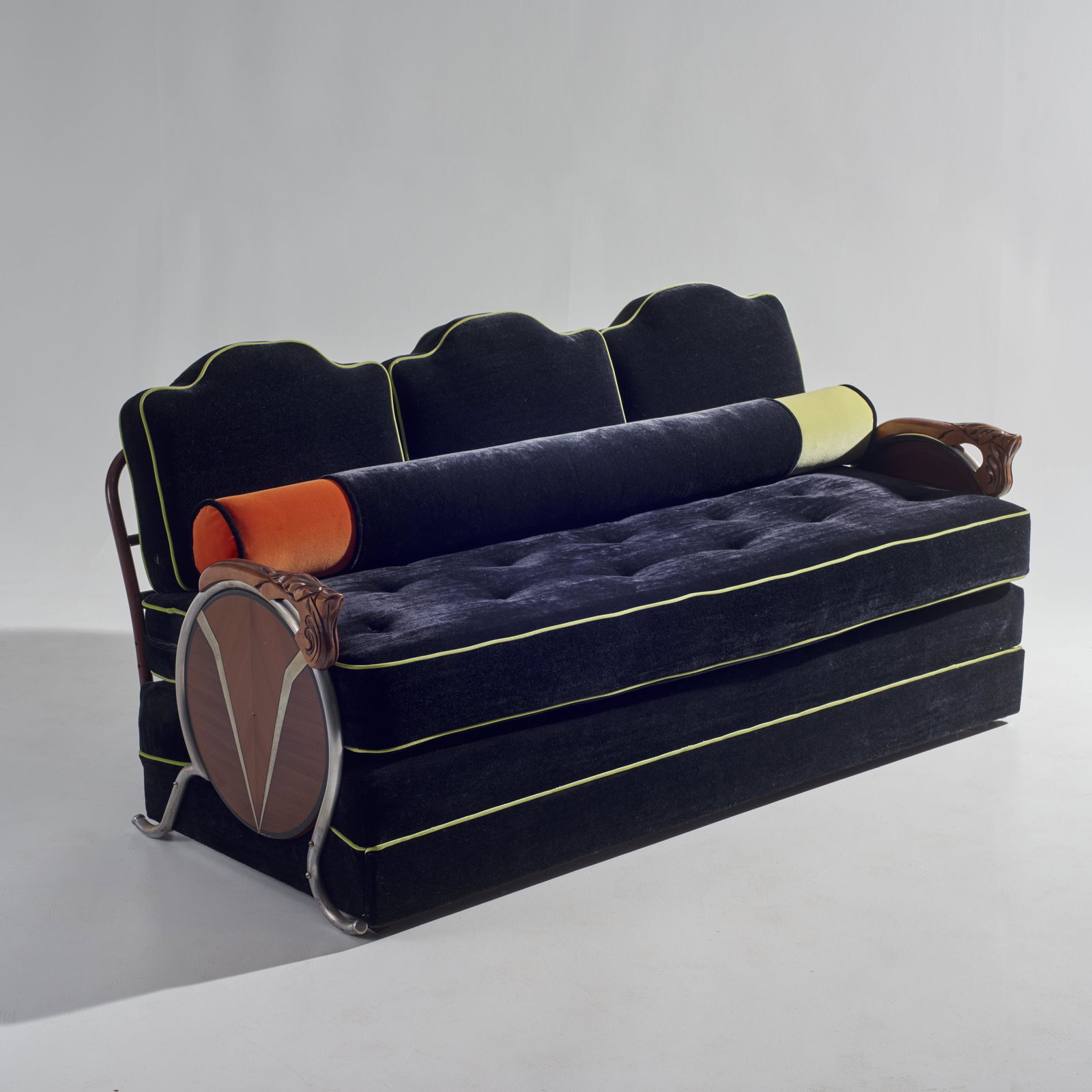 Fine Art Deco Black Mohair Sofa: Exquisite Antique Art Deco black mohair sofa with chartreuse green piping and back rest which is a large bolster for more comfort. The bottom cushion is tufted down with buttons. The arms are made of 