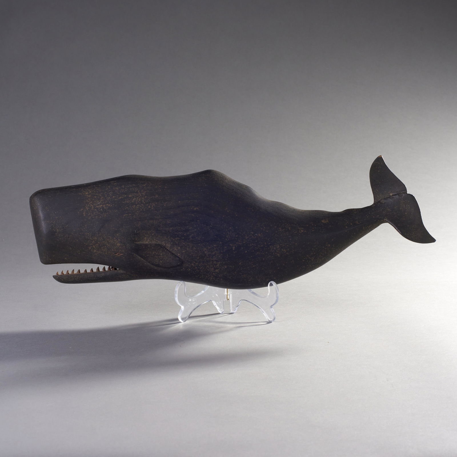 Clark G. Voorhees Jr. (1911-1980) Carved Sperm Whale: Clark G. Voorhees Jr. (1911-1980) Carved and painted wooden sperm whale plaque. Stamped verso CV and C. Voorhees. Condition: Tiny chip at tail top teeth intact. Measures: 17 1/2" L