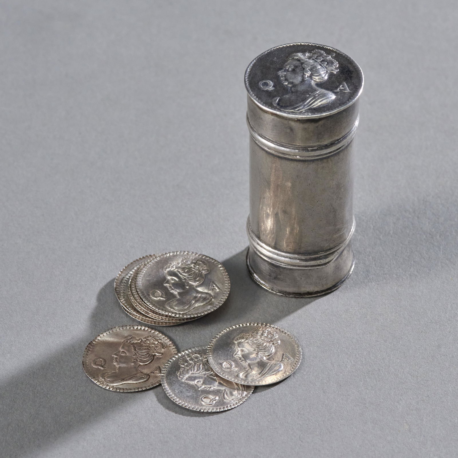 Rare Queen Anne Silver Counter Case With Counters,: Rare Queen Anne silver counter case. Circa 1710 having 12 stamped silver counters. Top and counter faces stamped with Queen Anne's profile and initials QA cylindrical case of rare tall height bottom m