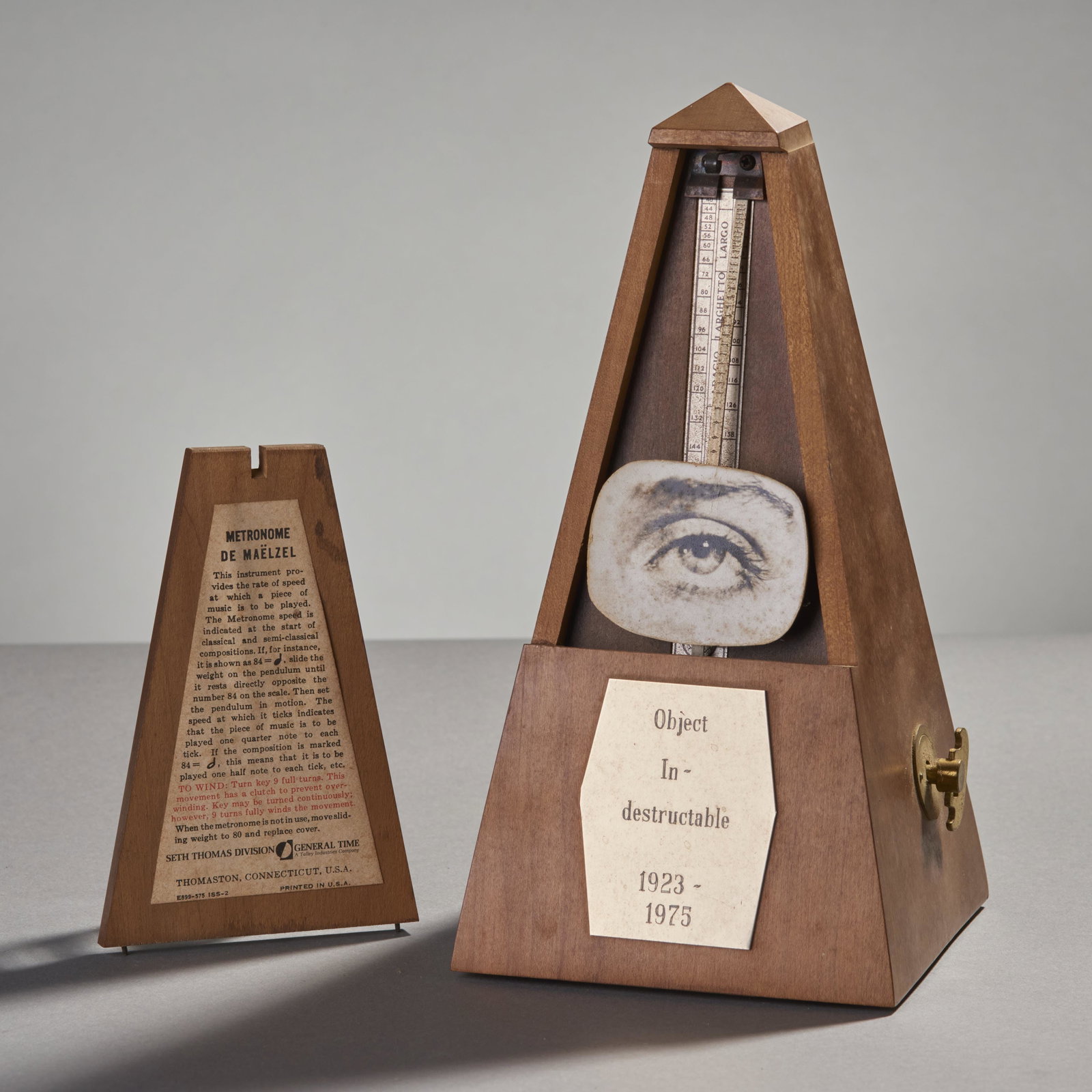 Man Ray (1923-1975) Object In-destructible Metronome: Man Ray (1923-1975) Object in-destructible metronome. The New York Cultural Center edition 16/200 collection 75.Signed in ink on the publication label. Condition: very good. Height: 9" Base: 4 1/2" sq