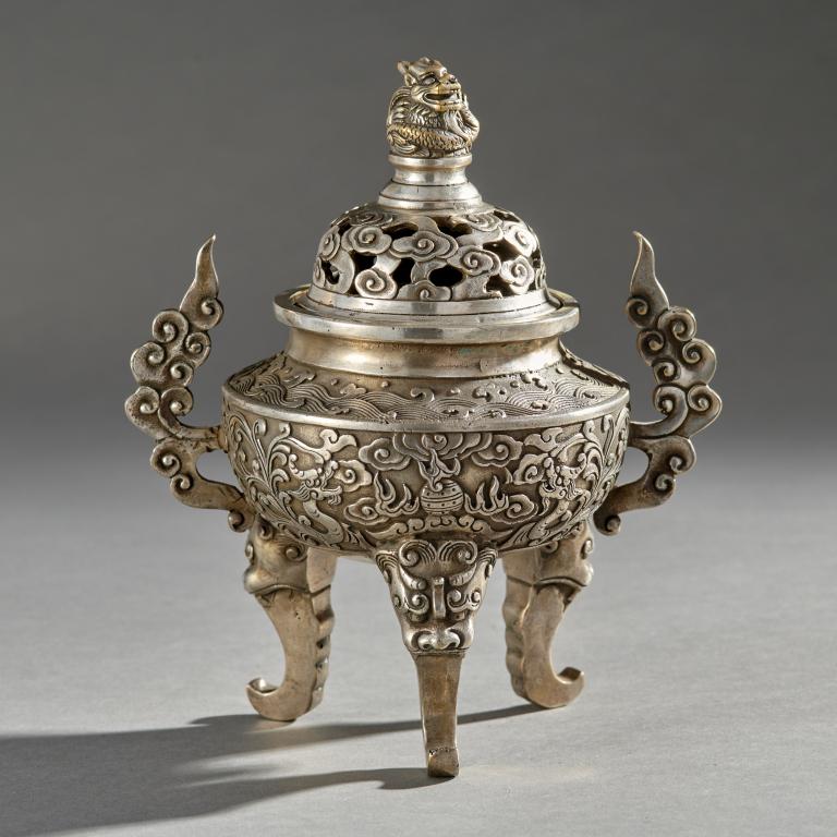 Tibetian Silver Plate Incense Burner: Tibetan silver plate incense burner with dragon motif and cloud band handles, signed on bottom. Measures: 8 1/4" H x 4 1/2"W x 6 1/2"D overall.