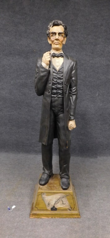 La Montagne Carved Wood Figure of Abraham Lincoln: Carved wood and polychrome figure of Abraham Lincoln with base, signed: A (Armand) La Montagne 1976. Measures: 82" H x 22" W x 21" D overall.