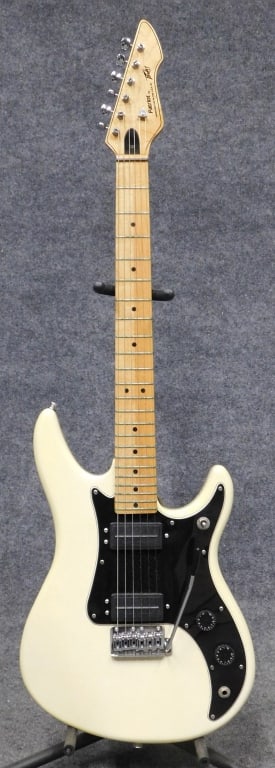 1986 Peavy Patriot Electric Guitar: 1986 Peavy Patriot electric guitar, white with power bend tremolo 1986, Made in USA, serial # 02557545. Complete with Peavy case.