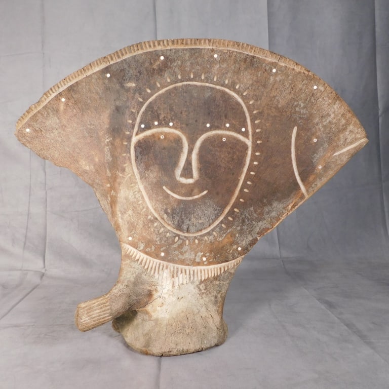 Edwin J. Weyiouanna Inuit Inlaid Bone Carving: Edwin J. Weyiouanna Inuit Bone Carving of a face with inlays, carved verso: 'Made By Edwin J. Weyiouanna, Shishmaref, AK 99772. Measures: 18" x 21" x 5".