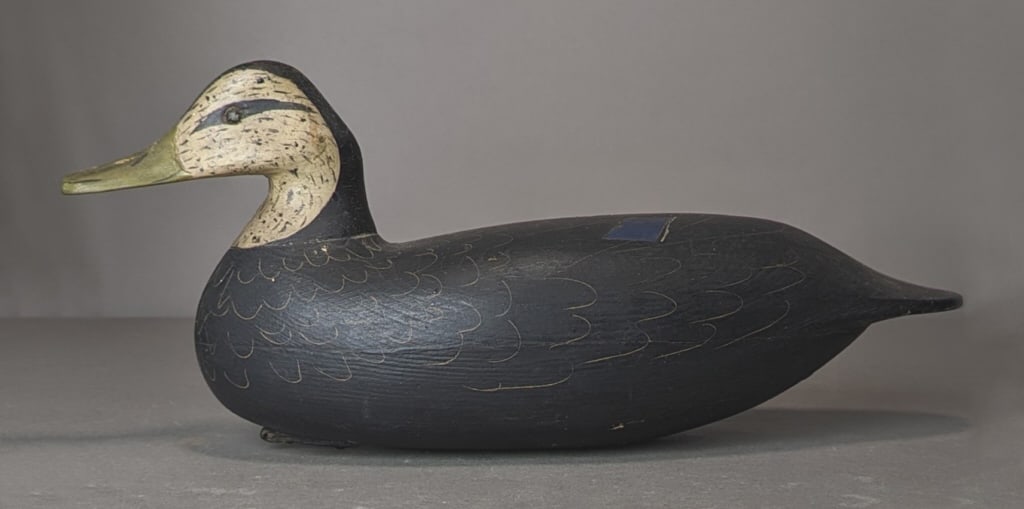 Duck Decoy, Branded RKC: Carved and painted wood duck decoy, weighted, branded on bottom: RKC. Measures: 7" x 16 1/2" x 6".