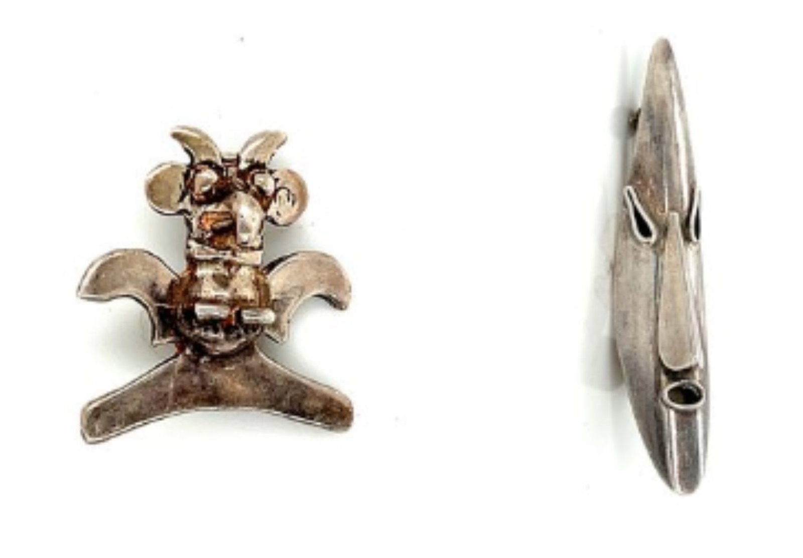 Lot of 2 Sterling Silver Tribal Brooches: Two sterling silver brooches --- Mask brooch: Weight: 4.9g Dimensions: 55.2x12.5mm --- Birch brooch Weight: 6.9g Dimensions: 28.6x26.4mm