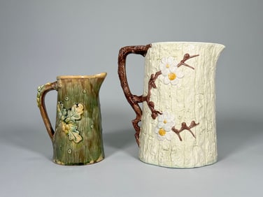 Two Majolica Pitchers with Oak Leaf and Dogwood Motifs