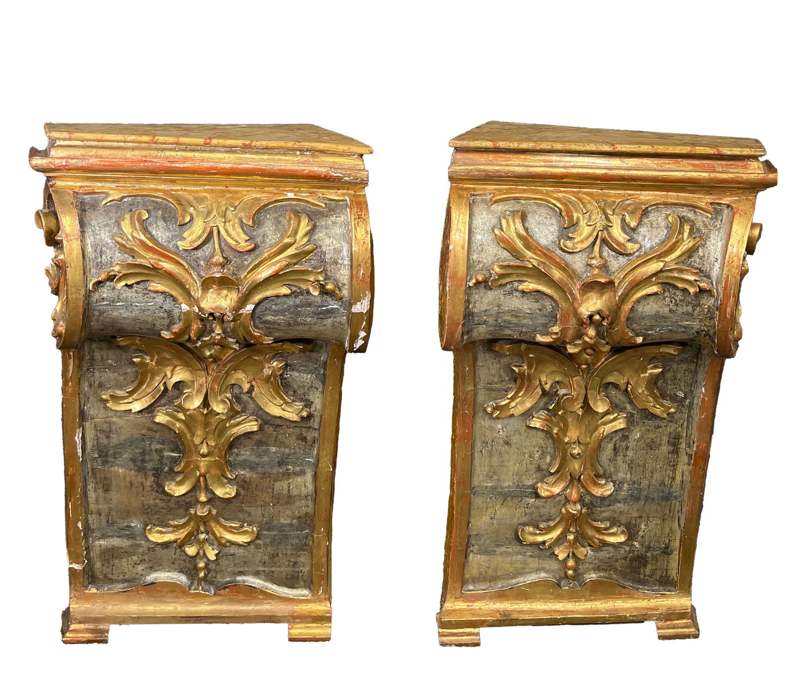 Pair of Monumental Parcel Gilt Corbels: Pair of parcel gilt wood corbels with faux marble tops. Dimensions: Height: 38 inches Width: 20 inches Depth: 12.5 inches