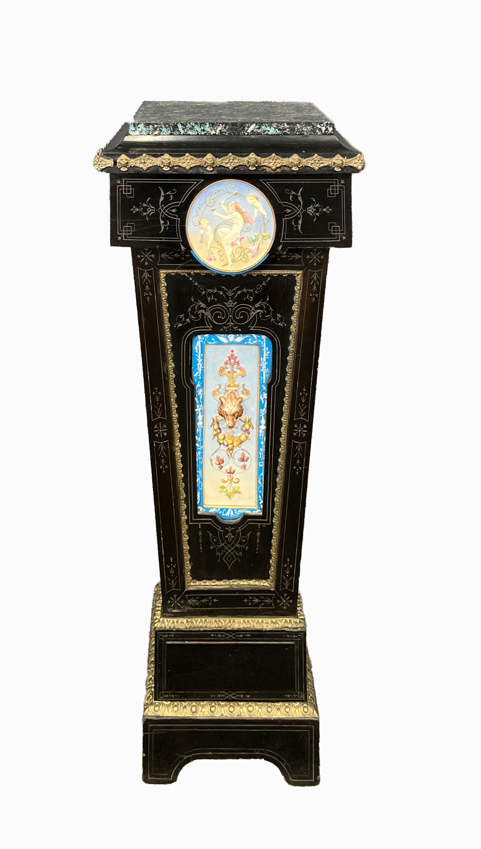 Ebonized Napoleon III Pedestal with Enameled Tiled Panels: An Napoleon III ebonized pedestal featuring an inset round enamel-painted plaque with classical-themed imagery at the front, complemented by a rectangular panel below adorned with floral and decorativ