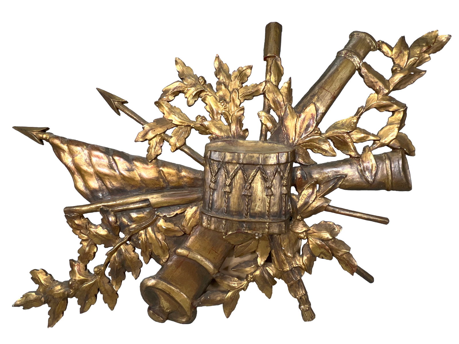 Carved Giltwood Military Trophy Wall Plaque: French style carved giltwood military trophy wall plaque. The intricate design features crossed military symbols including flags, drums, cannons, and laurel leaves. Dimensions: 25.75'' x