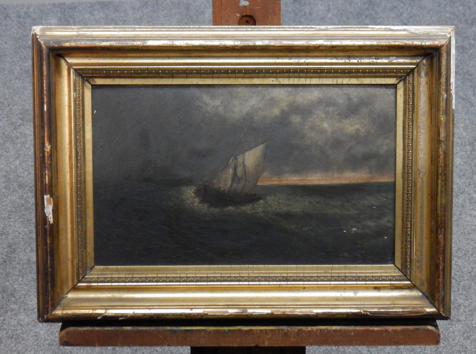 Boat at Sea Oil Painting: Oil painting of a ship in stormy seas. Likely late 19th or early 20th century. Artist unknown. Dimensions: 7.5" x 12.5" (sight); 12.5'' x 15.5'' (framed)