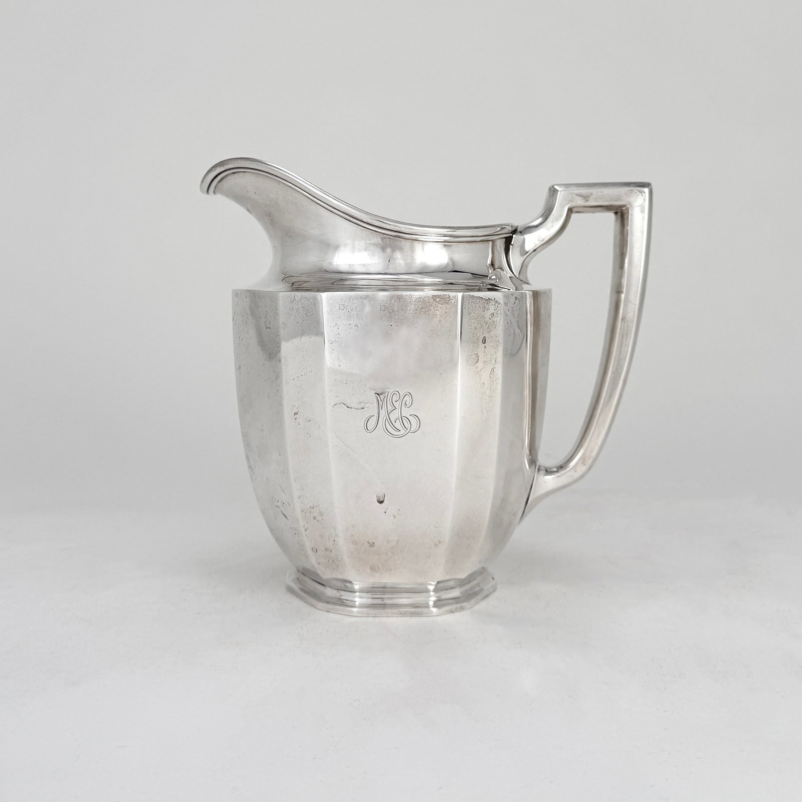 Tiffany & Co. Sterling Silver Water Pitcher: Tiffany & Co. sterling silver water pitcher with monogram, pattern number 18799. Dimensions: Height: 7.5" Width: 7.5" Weight: 718 grams