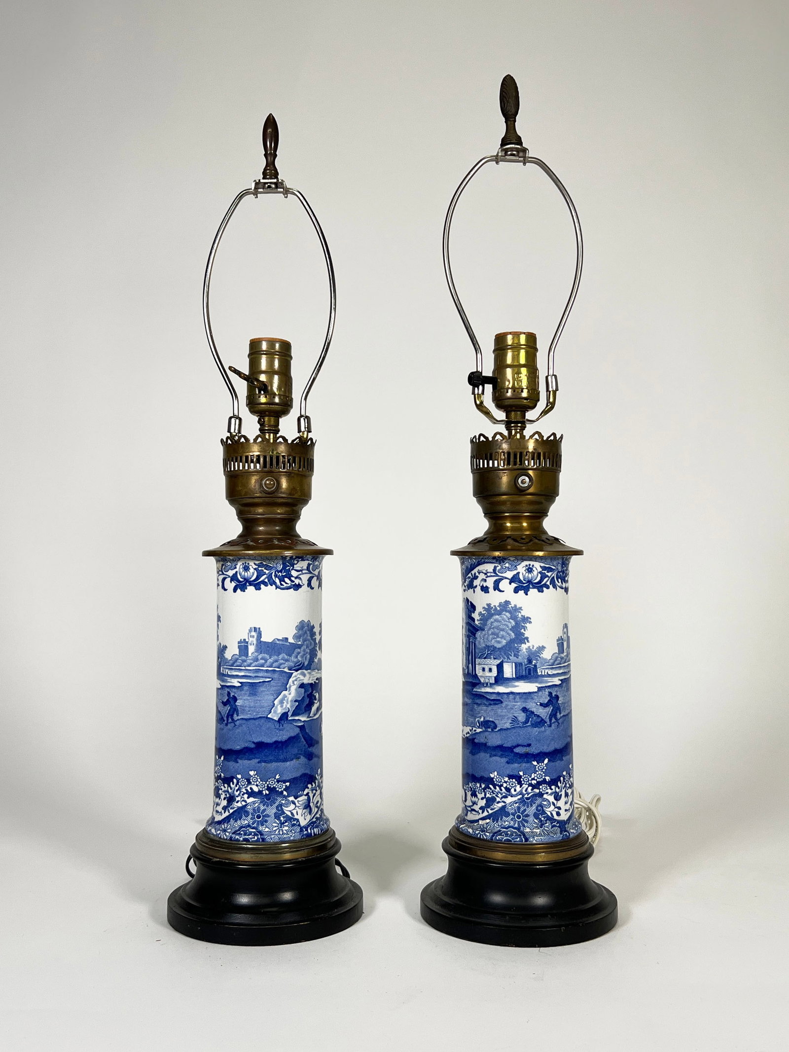 Pair of Blue and White Porcelain Table Lamps: Pair of blue and white transferware porcelain canister table lamps. Dimensions: Approximately 23" H