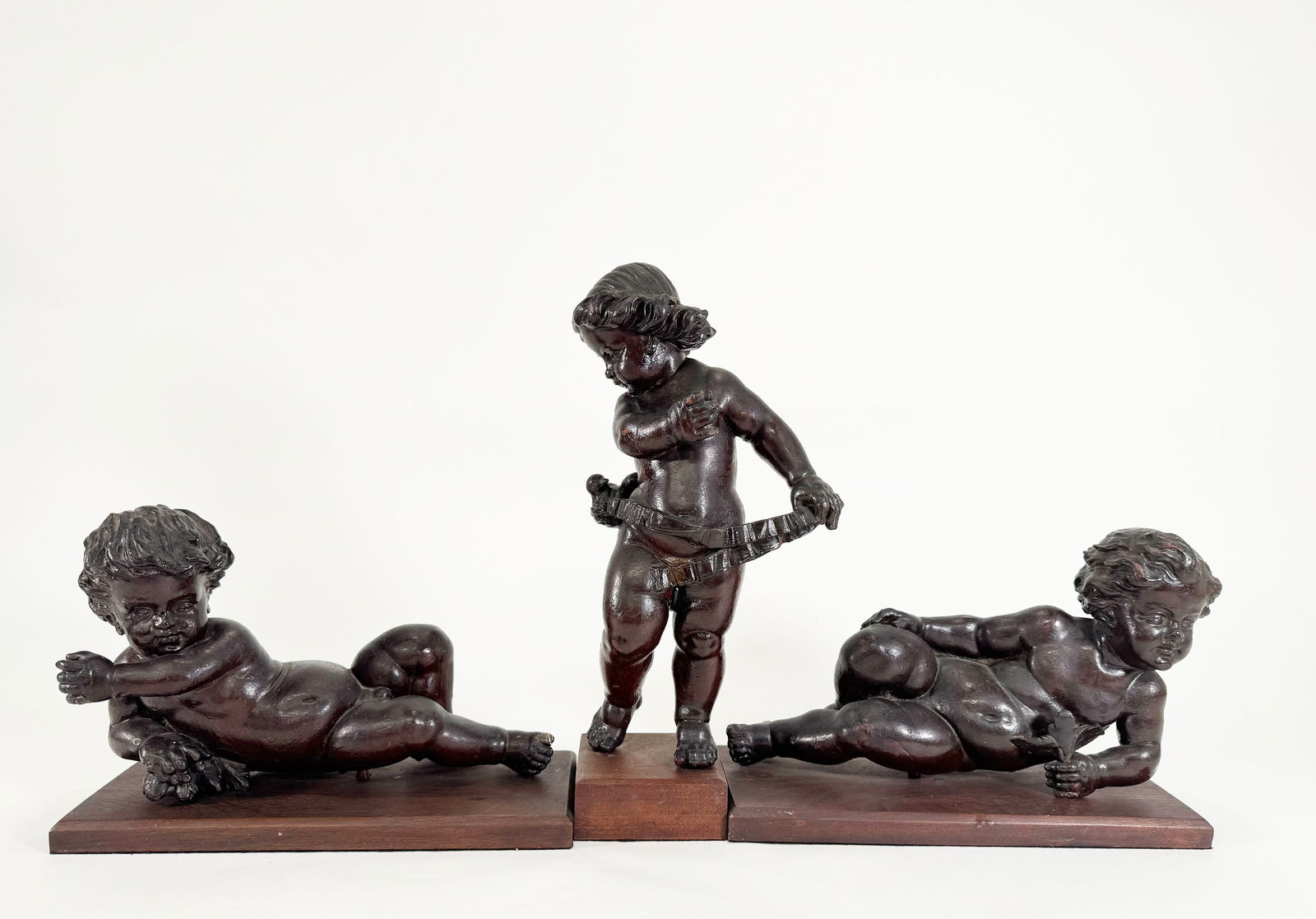 Three Carved Wooden Putti (1 of 4)