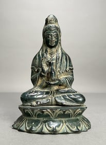 Seated Patinated Guanyin Figure on Lotus Base