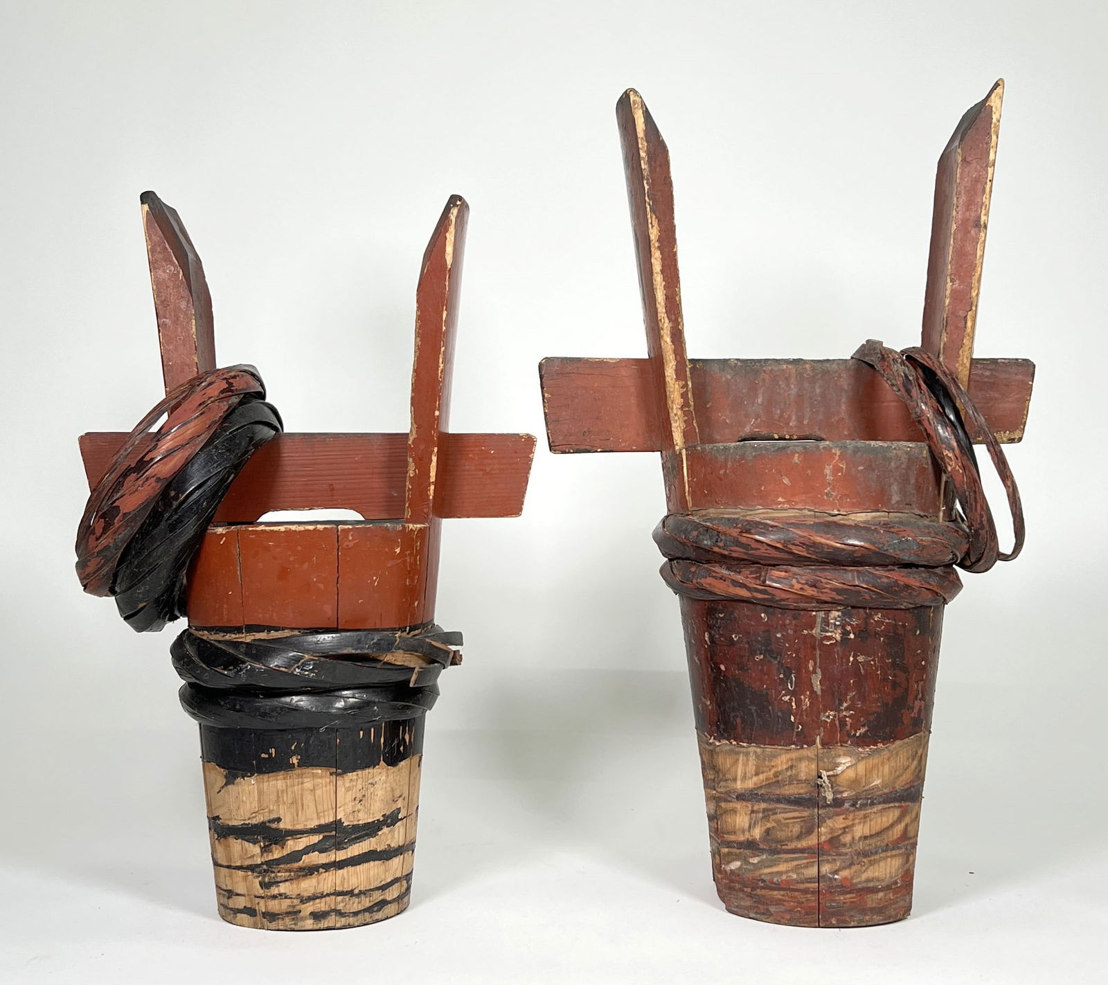 Antique Japanese Tsunodaru Sake Barrels: Pair of antique Japanese tsunodaru sake barrels, typically used for celebratory events (such as weddings). Tallest barrel is approximately 23" tall.