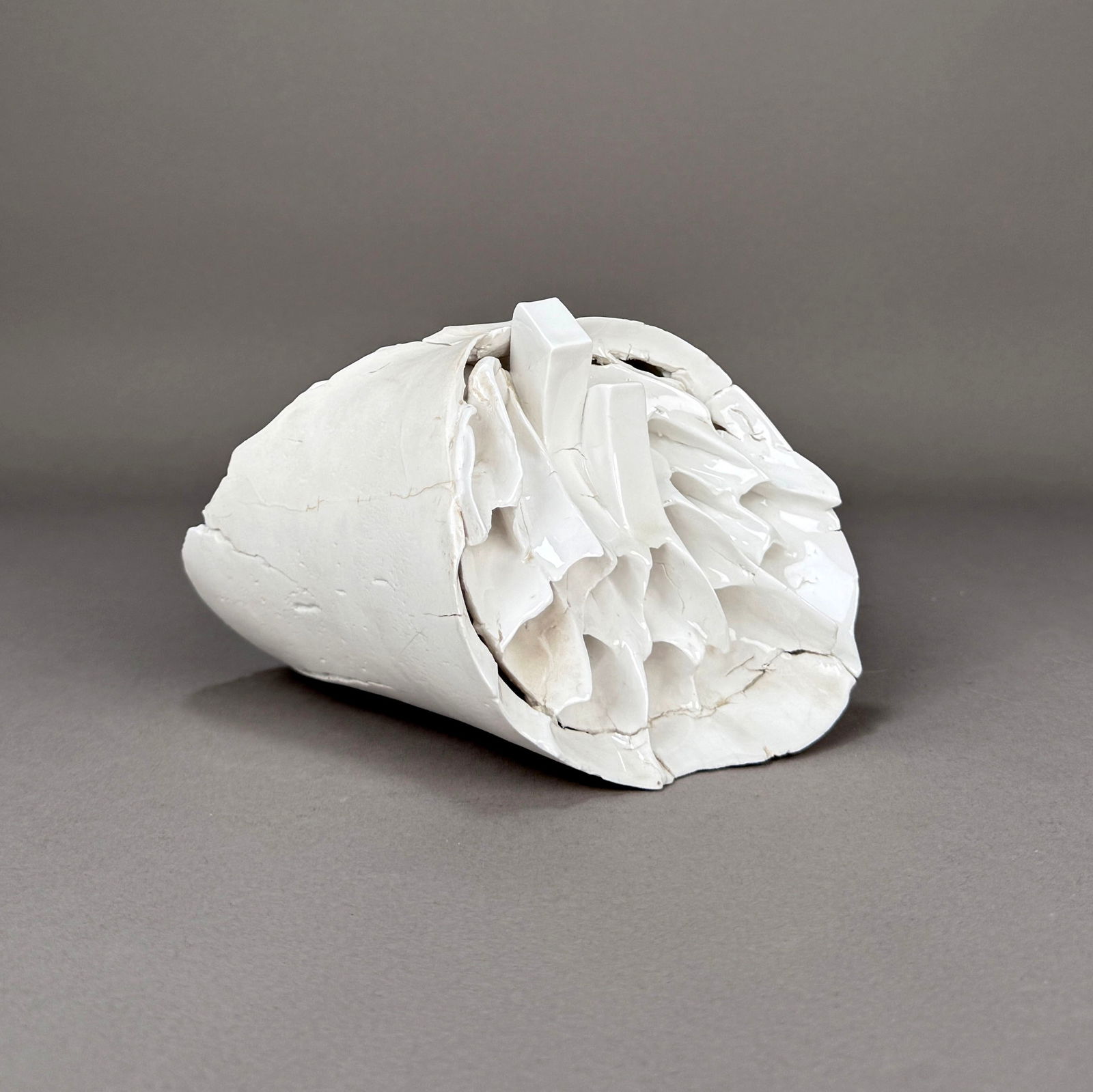 Kurt Spurey Ceramic Sculpture: Kurt Spurey (Australian, b. 1941), 'Piece of Coral, Number 28', ceramic, 1975, signed and dated. The piece features an organic, abstract form with intricate textural details and a fragme