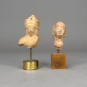 Two Bust Fragments on Stands