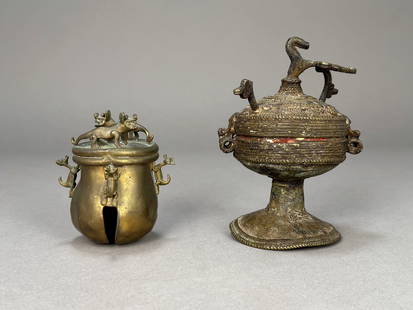 Two Southeast Asian Brass Objects: A group of two Southeast Asian brass objects. A&nbsp;20th century Chinese&nbsp;brass censer with&nbsp;6 foo dogs on the top and sides and slotted opening on the bottom and a 19th/20th century Himalaya
