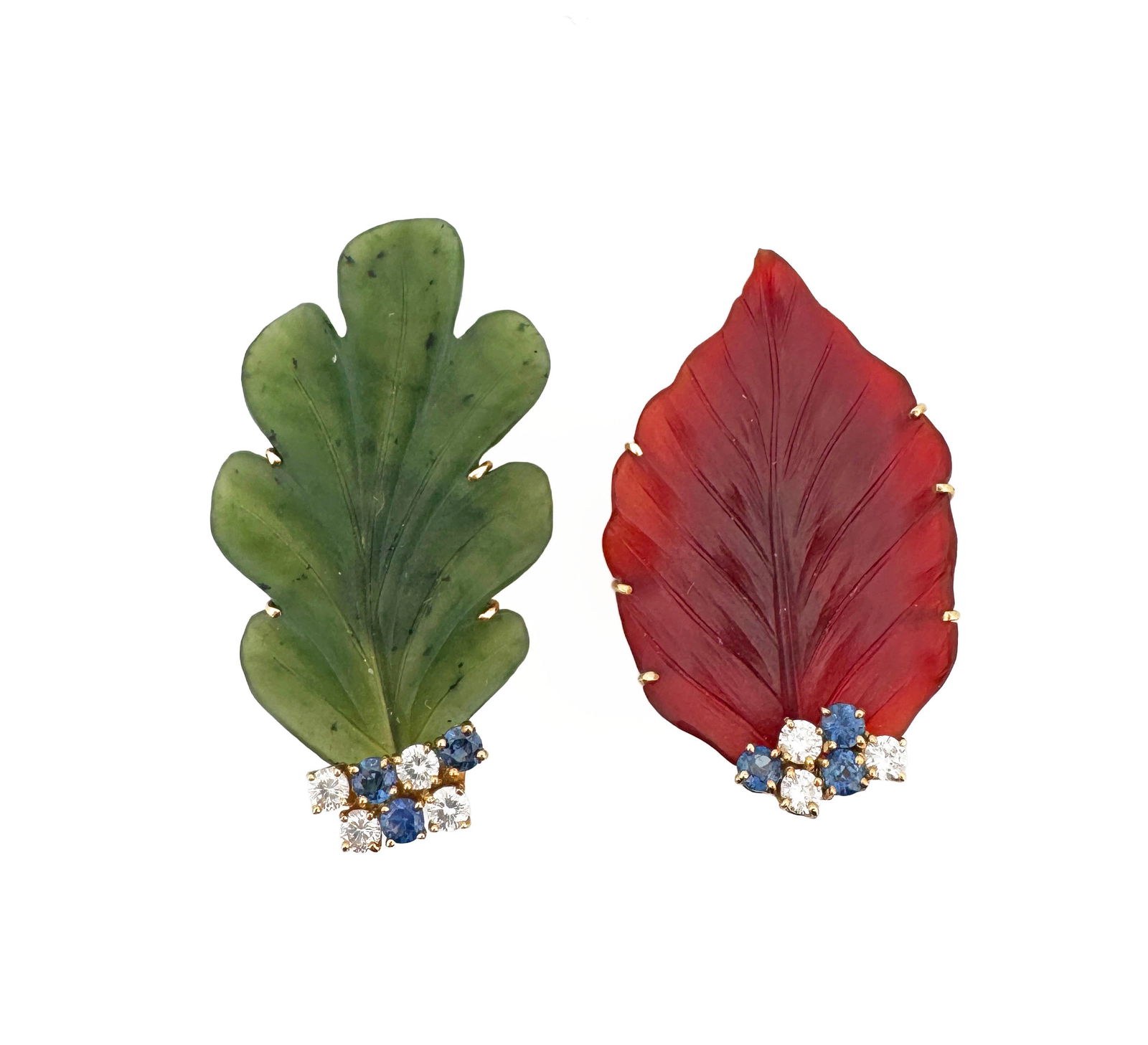 Tiffany & Co Paloma Picasso Nephrite & Carnelian Earrings: Paloma Picasso for Tiffany & Co 18k yellow gold leaf earrings, one carved nephrite and one carved carnelian, each with round brilliant diamonds and sapphires 21.9g Largest earring: 51.85mm Each di