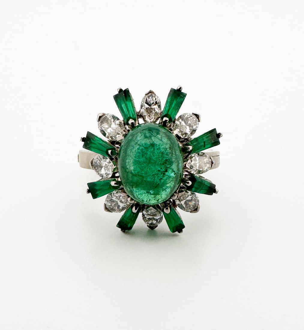 14k Emerald & Diamond Ring: 14k white gold ring featuring a ~2.59ct cabochon emerald surrounded by 8 marquise diamonds, ~0.80ctw, and 8 baguette emeralds, ~0.80ctw