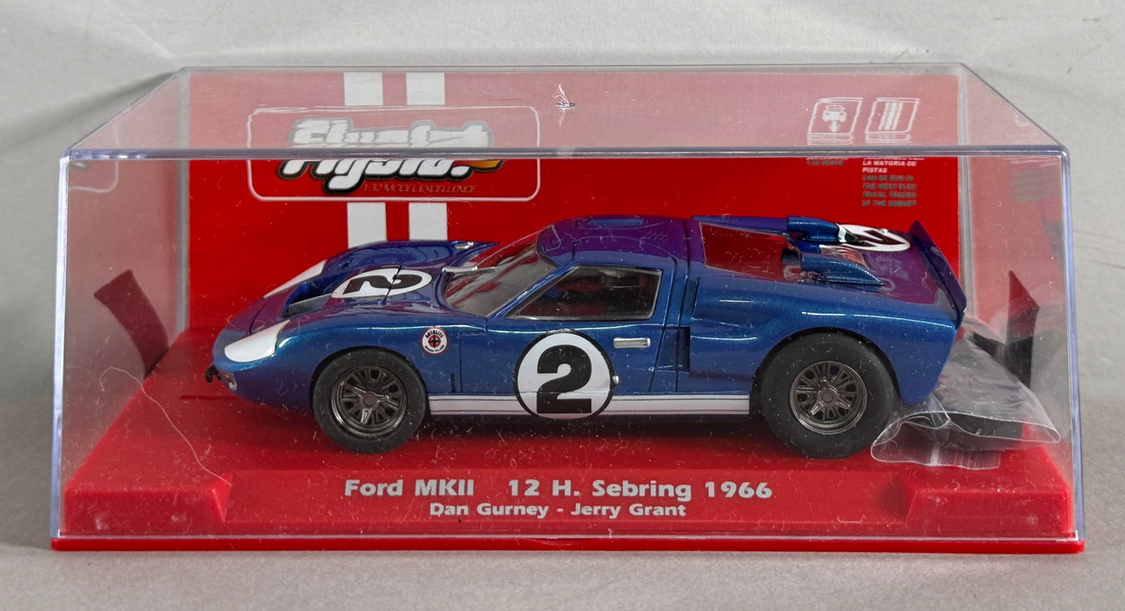 Flyslot Ford MKII 12 H. Sebring 1966 #2 1/32 Slot Car: Flyslot Ford MKII 12 H. Sebring 1966 Dan Gurney - Jerry Grant #2 1/32 Slot Car. Reference #708101, with original case. 