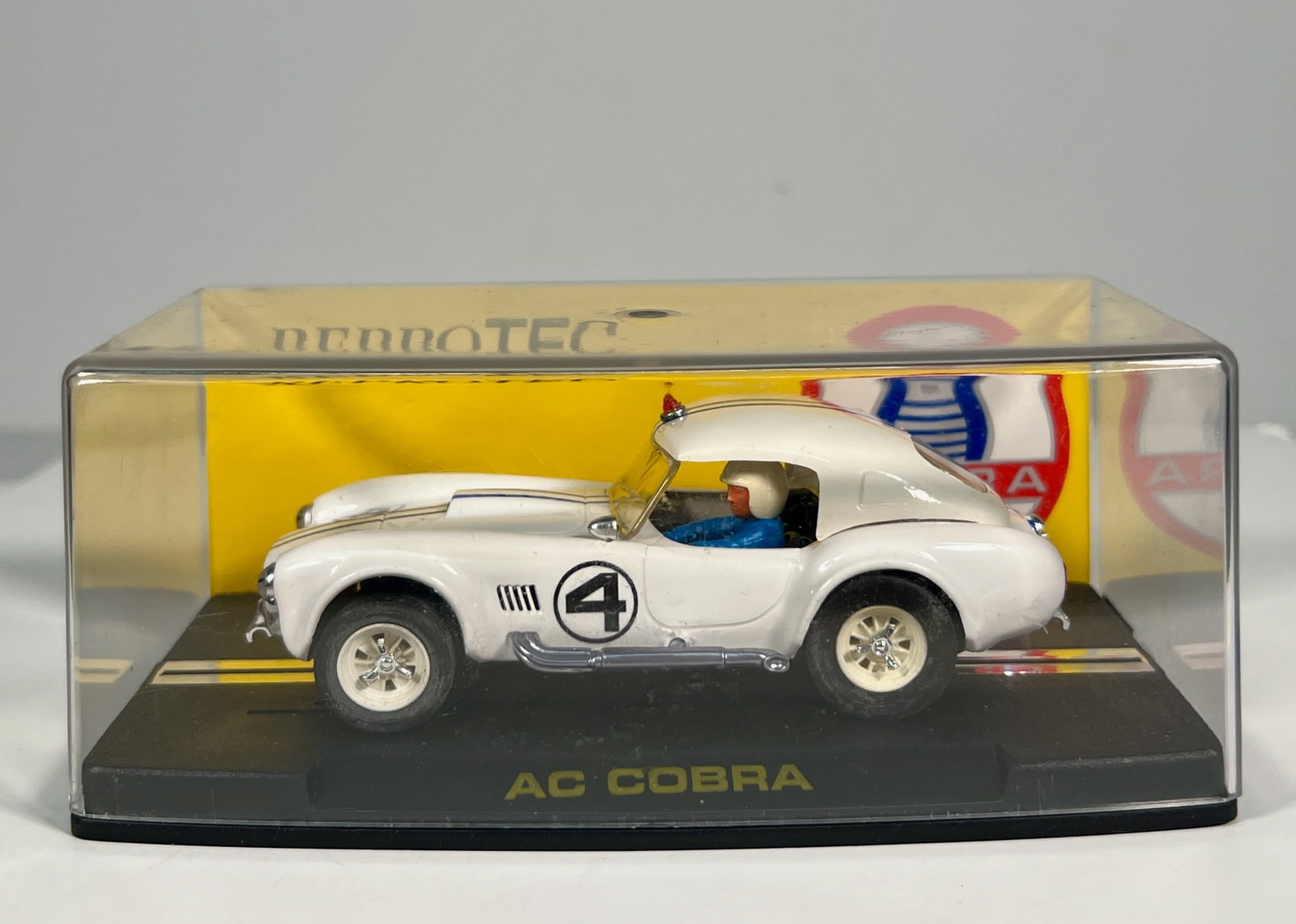 Reprotec AC Cobra Coupe Le Mans '63 #4 1/32 Slot Car: Reprotec AC Cobra Coupe Le Mans '63 #4 1/32 Slot Car. Reference #RT/1966, with original case. Weight: 6 oz.