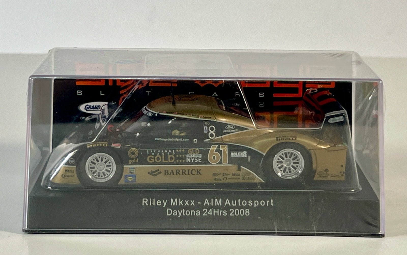 Sideways Riley MKXX AIM Autosport Daytona 24Hrs 2008 #61 1/32 Slot Car: Riley MKXX AIM Autosport Daytona 24Hrs 2008 #61 Barrick 1/32 Slot Car, with original case. Weight: 6 oz. Shrink wrapped - never opened.