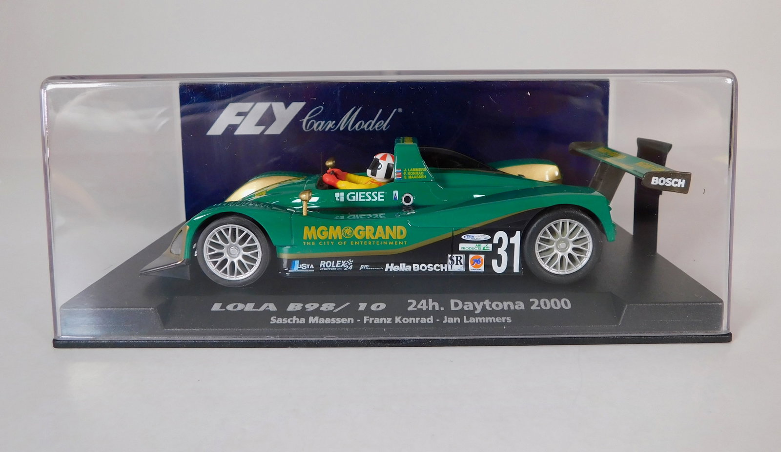 Fly Car Model Lola B98/10 24h Daytona 2000 #31 1/32 Slot Car: Fly Car Model Lola B98/10 24h Daytona 2000 Maassen - Konrad - Lammers #31 MGM Grand 1/32 Slot Car, A-508. Reference #88096, with original case. Weight: 6.2 oz.