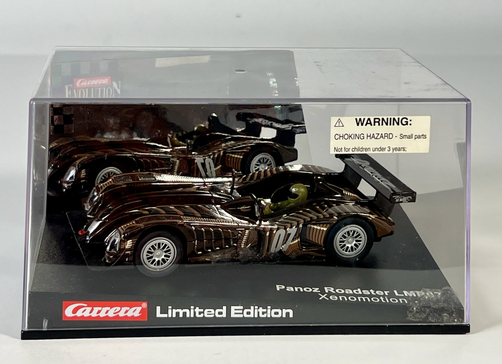 Carrera Evolution Panoz Roadster LMP07 Xenomotion Limited Edition #07 1/32 Slot Car: Carrera Evolution Panoz Roadster LMP07 Xenomotion Limited Edition #07 1/32 Slot Car, with original case. Case measures 7.25 inches in length and the total weight is 12.1 oz.