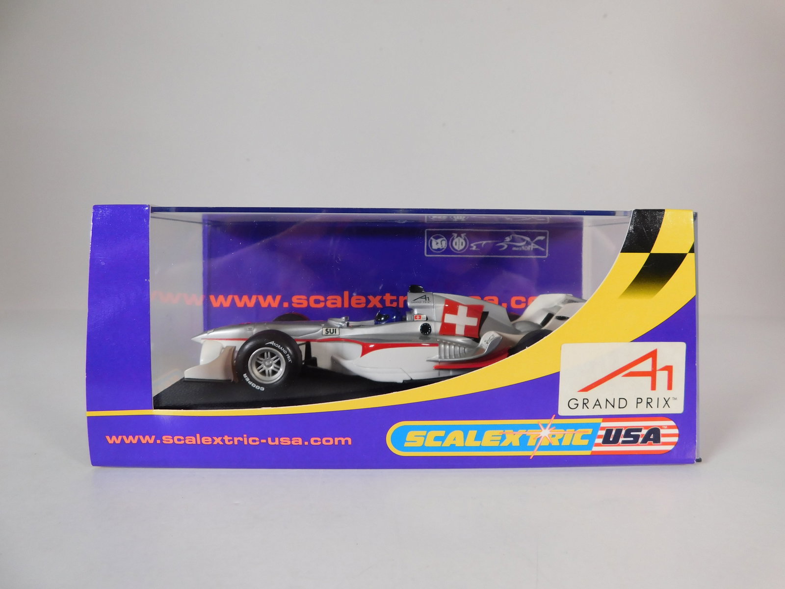 Scalextric USA A1 Grand Prix Team Switzerland 1/32 Slot Car: Scalextric USA A1 Grand Prix Team Switzerland 1/32 Slot Car. Reference #C2709, with original case. Weight: 7.3 oz.