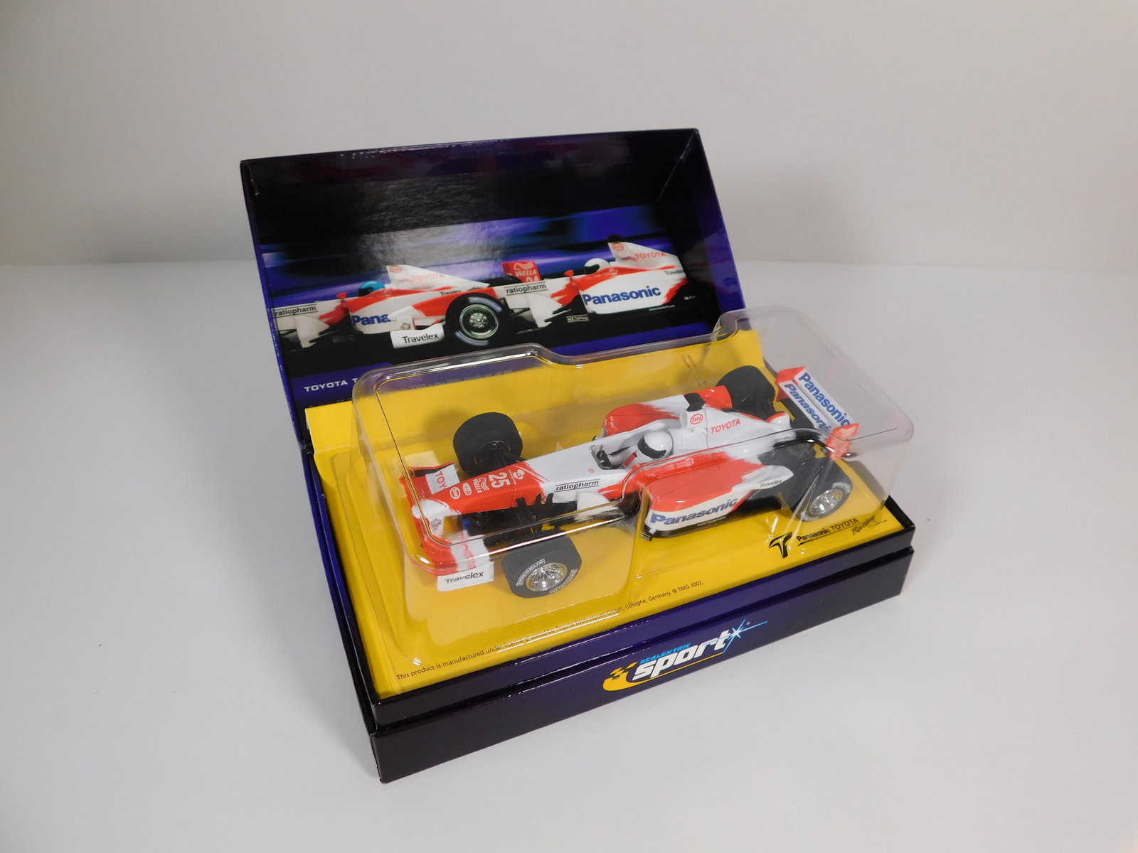 Scalextric Sport Panasonic Toyota Racing TF102 #25 1/32 Slot Car: Scalextric USA Sport Panasonic Toyota Racing TF102 #25 1/32 Slot Car. Reference #C2456AT, with original case. Box measures 7.5 inches in length and the car weighs 8.5oz.