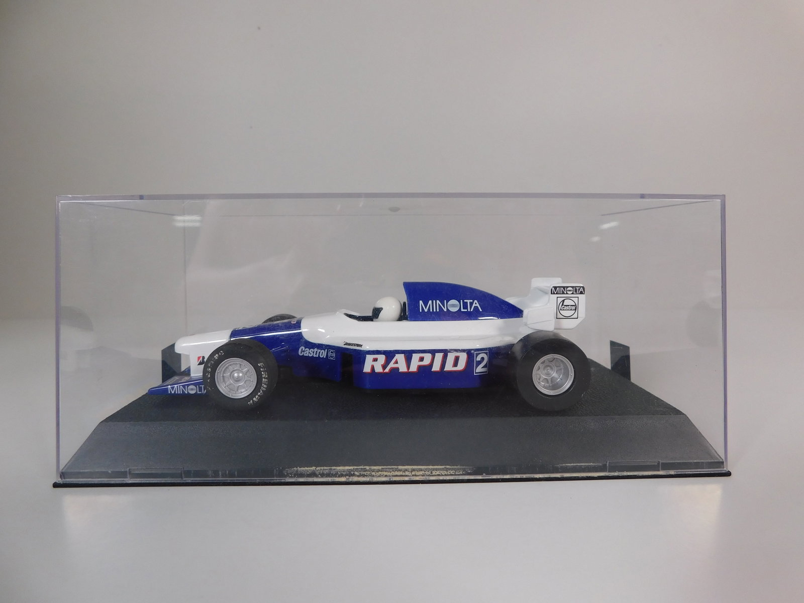 Scalextric Rapid Minolta #2 1/32 Slot Car: Scalextric Rapid Minolta #2 1/32 Slot Car, with original case. Weight: 6.4oz.