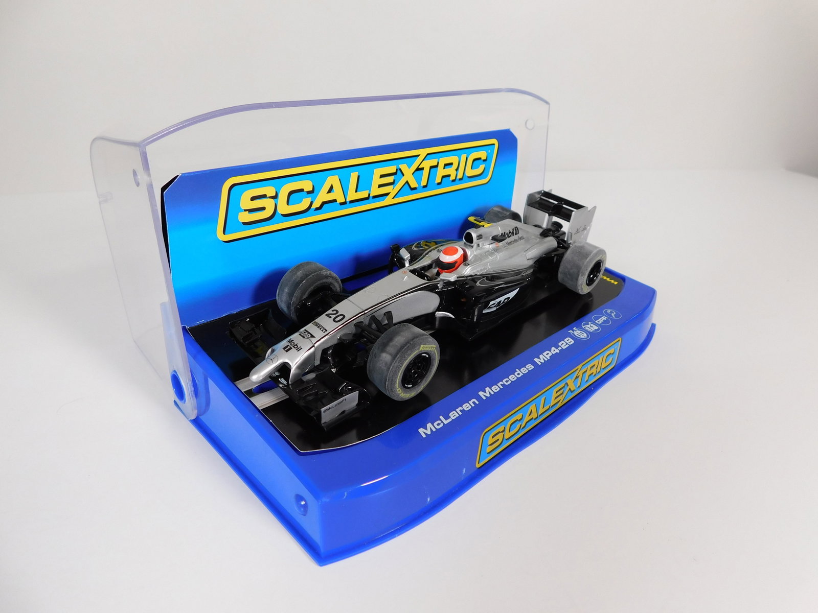Scalextric McLaren Mercedes MP4-29 #20 1/32 Slot Car: Scalextric McLaren Mercedes MP4-29 Monaco/Sap Magnussen #20 Mobil 1 1/32 Slot Car. Reference #C3665, with original case. Weight: 7.2 oz. Box length: 7.25 inches.