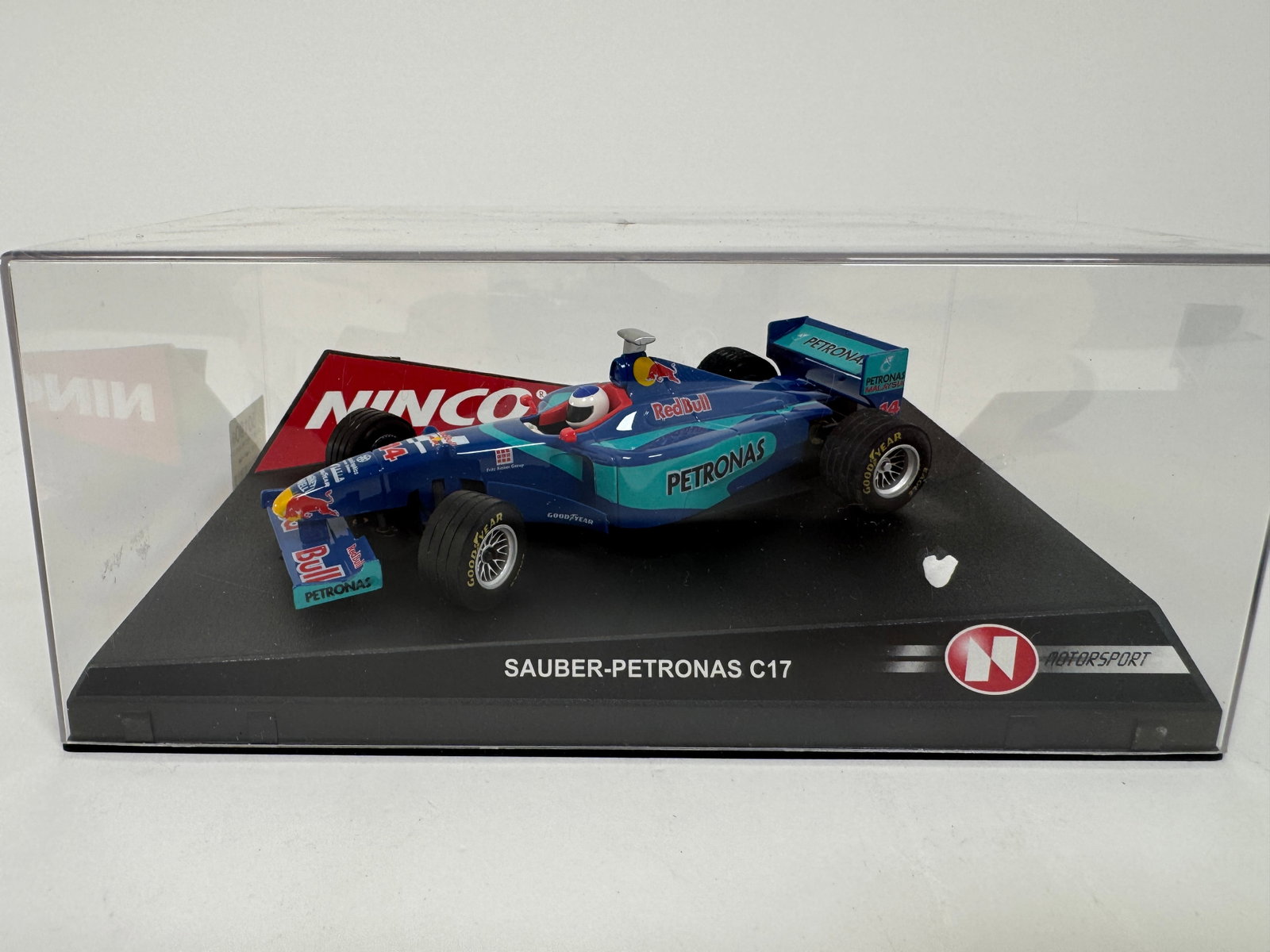 Ninco Sauber Petronas C17 #14 RedBull 1/32 Slot Car: Ninco Sauber Petronas C17 #14 RedBull 1/32 Slot Car. Reference #50190, with original case. Weight: 9 oz.