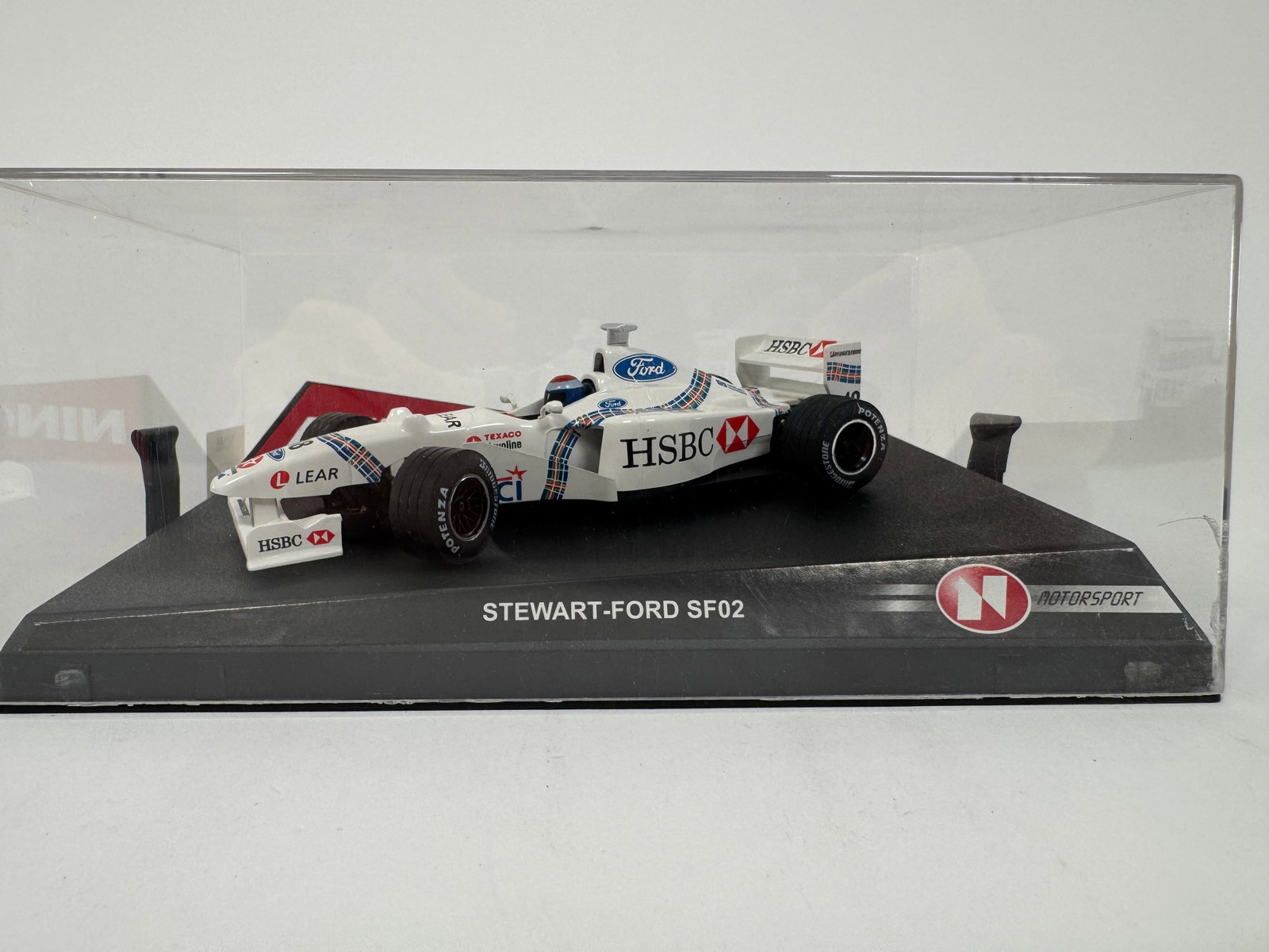 Ninco Stewart-Ford SF02 #18 HSBC 1/32 Slot Car: Ninco Stewart-Ford SF02 #18 HSBC 1/32 Slot Car. Reference #50185, with original case. Case measures 8 inches in length and weighs 9 ounces. 