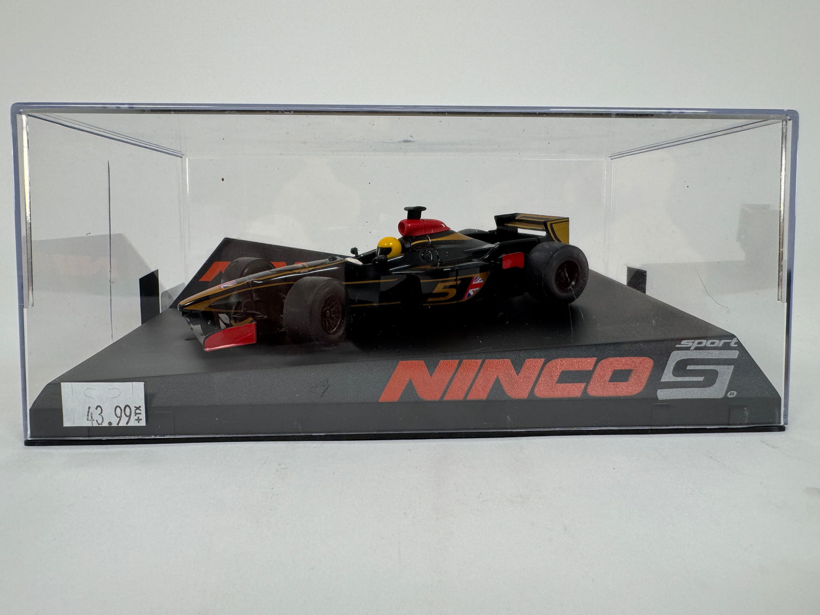 Ninco S Formula Black 1/32 Slot Car: Ninco S Formula Black race car model, displayed in a clear plastic case on a black base. 