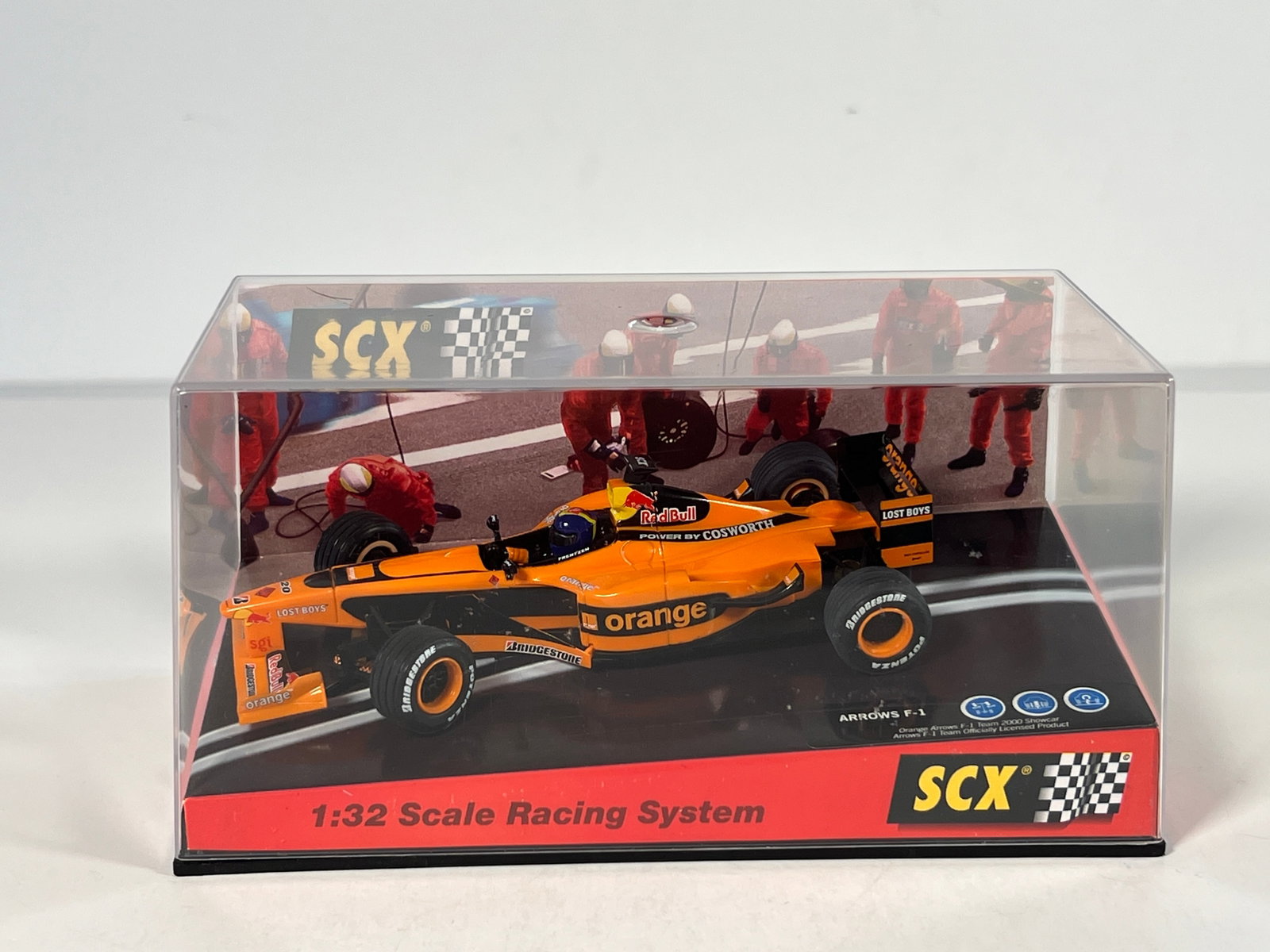 SCX Arrows F1 2000 Showcar 1/32 Slot Car: SCX Arrows F1 1:32 Scale Racing System slot car. Orange Arrows 2000 Showcar. In original packaging.