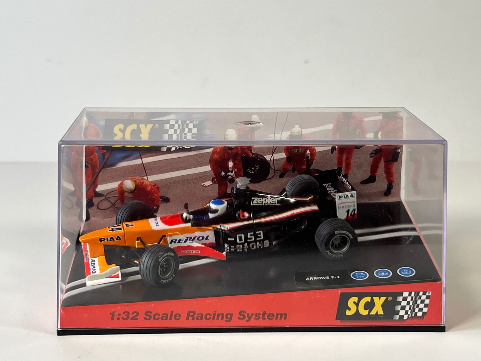 SCX Arrows F1 Australia 1999 #14 1/32 Slot Car: SCX Arrows F1 Australia 99 #14 Repsol 1/32 Slot Car. Reference #60400, with original case. Case measures 7.25 inches in length and weighs 7 oz.