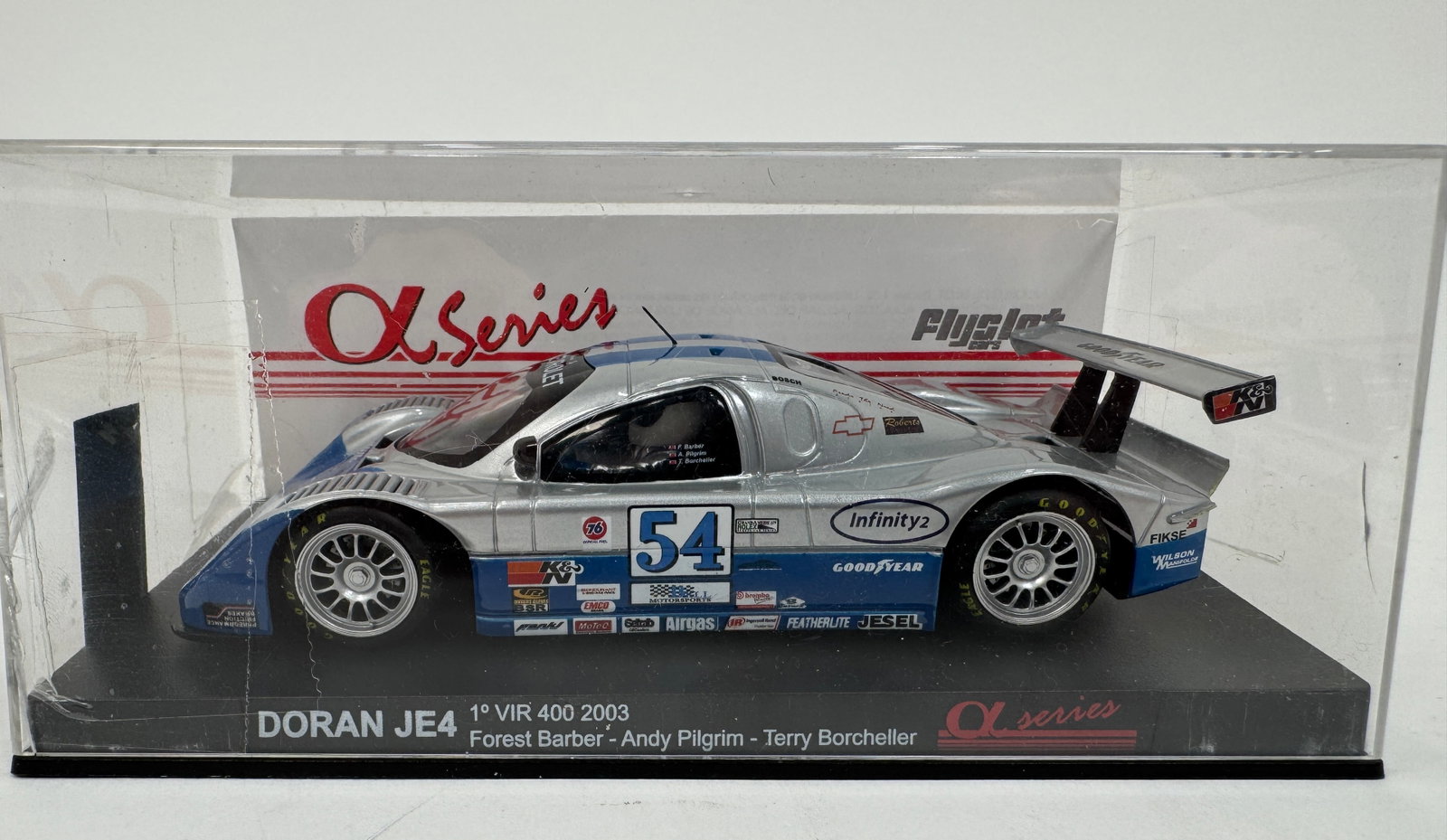 Flyslot Doran JE4 VIR 400 2003 1/32 Slot Car: Flyslot Alpha Series 1/32 scale model of the Doran JE4, which won the VIR 400 in 2003. Driven by Forest Barber, Andy Pilgrim, and Terry Borcheller. In original display case.