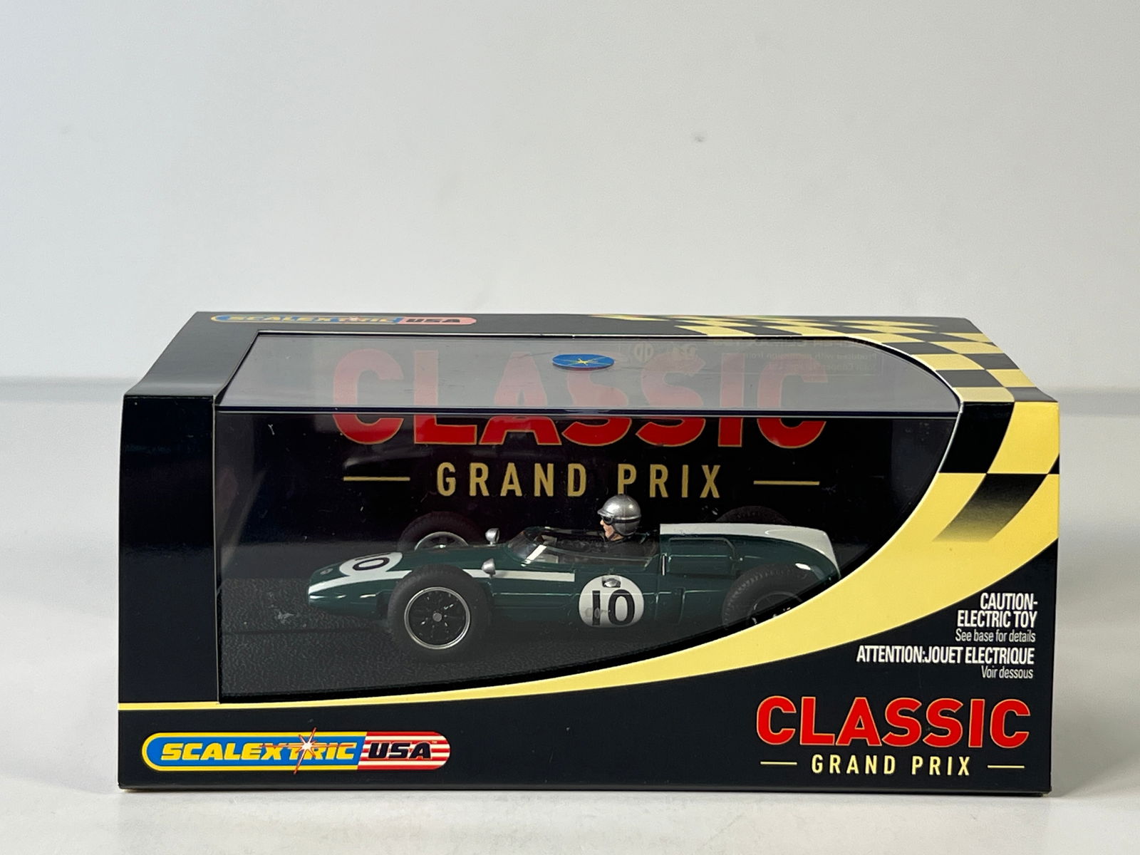 Scalextric USA Classic Grand Prix Cooper Climax T53 #10 1/32 Slot Car: Scalextric USA Classic Grand Prix Cooper Climax T53 #10 1/32 Slot Car, with original case. Case length 7.25 inches, weight 7 oz.