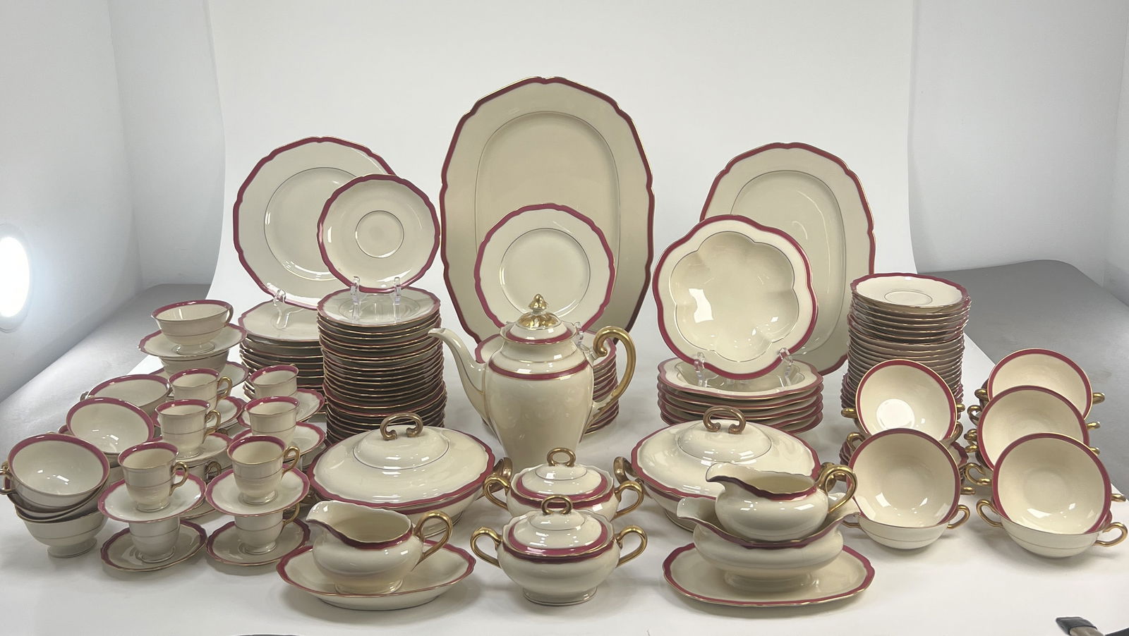 Vintage Black Knight China Dinnerware Set, Burgundy Trim: Extensive Black Knight bone china dinnerware set featuring a burgundy trim and gold accents. Includes plates, bowls, cups, saucers, teapot, serving dishes, and more. Dimensions: Teacups 2.5 x 2 inches