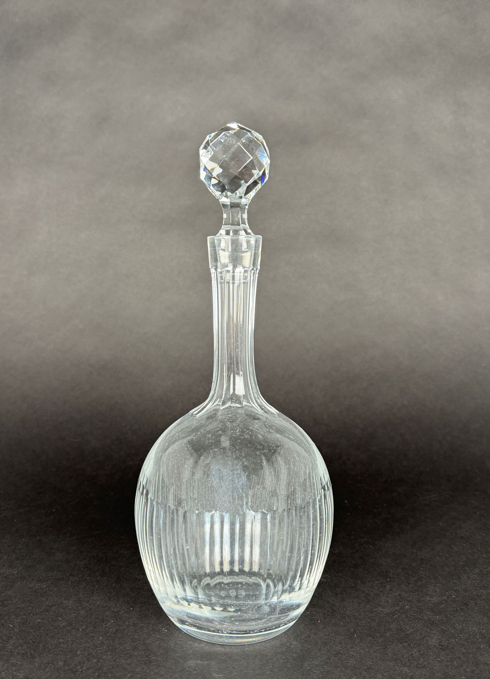 Baccarat Crystal Decanter: Baccarat crystal decanter with a faceted stopper. 10.5" tall and weighs 35.8 oz.