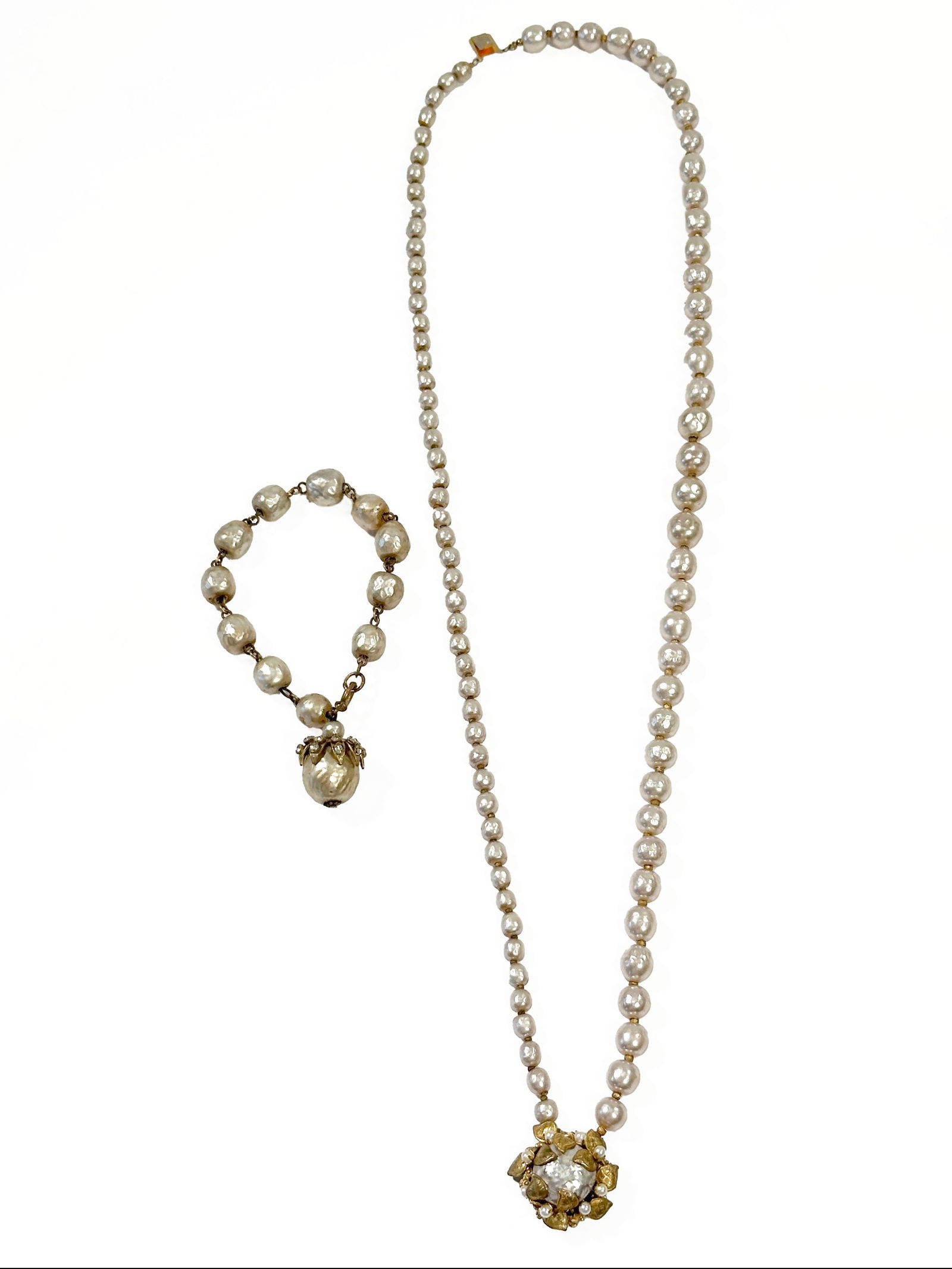 Miriam Haskell Faux Pearl Necklace & Bracelet Set: Miriam Haskell faux pearl necklace and bracelet set. Signed on necklace clasp reverse. Necklace length: 15.5 inches. Bracelet length: 4.5 inches. Weight: 107.7g