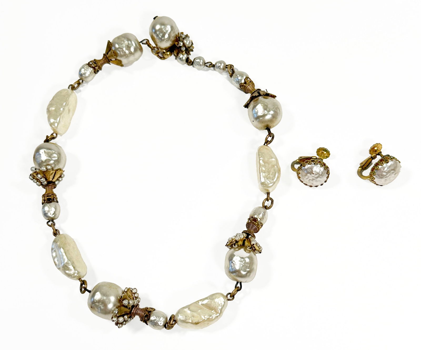 Miriam Haskell Large Faux Pearl Necklace and Earring Set: Miriam Haskell faux pearl necklace and earring set. Marked Miriam Haskell and PAT 24005 on each earring. Necklace is 8" long and earrings are 1.75" long. Total weight is 2.4 oz.